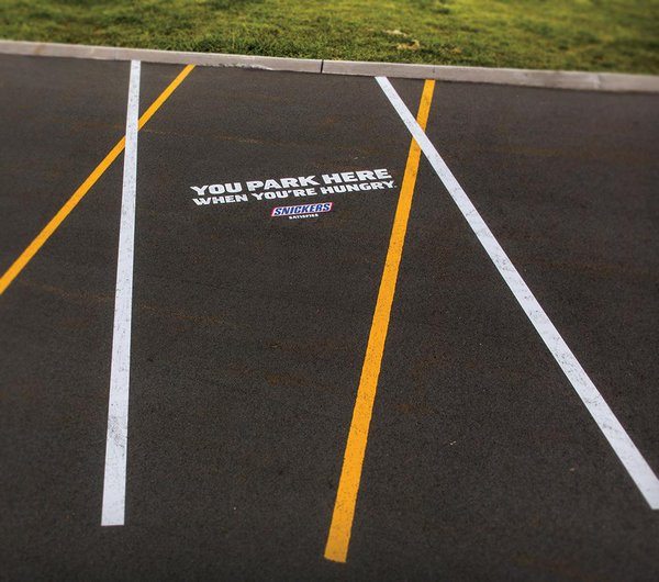 parking lot advertising stripes by snickers